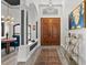 Elegant entryway featuring wood floors, arched doorways, and a stylish light fixture at 13137 Lake Butler Blvd, Windermere, FL 34786