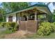 Outdoor horse stall with lighting, storage, and pasture access, providing a safe and comfortable home for horses at 13137 Lake Butler Blvd, Windermere, FL 34786