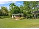 Outdoor horse stall offers shelter, storage, and access to the surrounding pasture, perfect for equestrian enthusiasts at 13137 Lake Butler Blvd, Windermere, FL 34786