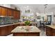 Spacious kitchen with granite countertops, dark wood cabinets, and open layout at 13137 Lake Butler Blvd, Windermere, FL 34786