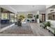 Expansive living room with backyard pool views, modern decor, and seamless indoor-outdoor living at 13137 Lake Butler Blvd, Windermere, FL 34786