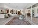 Expansive living room boasts modern design elements, light wood floors, and views to other areas of the house at 13137 Lake Butler Blvd, Windermere, FL 34786