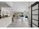 Open floor plan leading into a living room, with a barn door on the right at 13137 Lake Butler Blvd, Windermere, FL 34786