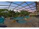 Inviting screened pool with water feature and a relaxing spa creates a luxurious outdoor oasis at 13137 Lake Butler Blvd, Windermere, FL 34786