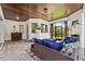 Cozy sunroom with brick flooring, wicker seating, and views to the patio at 13137 Lake Butler Blvd, Windermere, FL 34786