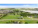 Breathtaking aerial view of an expansive property with a lake, mature trees and manicured lawn at 150 Berkley Knights Dr, Auburndale, FL 33823