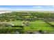 Majestic aerial view of a large estate surrounded by verdant landscapes and serene scenery at 150 Berkley Knights Dr, Auburndale, FL 33823