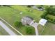 Beautiful aerial view showcasing a sprawling estate with lush greenery and mature trees at 150 Berkley Knights Dr, Auburndale, FL 33823