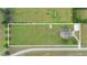 Aerial view of the property featuring a spacious lot, sparkling pool, and well-maintained landscaping at 150 Berkley Knights Dr, Auburndale, FL 33823