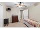 This bedroom features a ceiling fan, wall mounted television, and standard closet at 150 Berkley Knights Dr, Auburndale, FL 33823