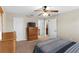 This bedroom features a ceiling fan and neutral colored walls at 150 Berkley Knights Dr, Auburndale, FL 33823