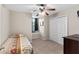 This bedroom features a large window, a small sitting area, and closet at 150 Berkley Knights Dr, Auburndale, FL 33823