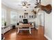 Office space with hardwood floors, large windows, built in shelves, and mounted animal decor at 150 Berkley Knights Dr, Auburndale, FL 33823