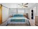 Comfortable bedroom with a large bed, ample natural light, and stylish decor at 1506 Longbow Dr, Lakeland, FL 33810