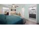 A primary bedroom features wood floors and a ceiling fan, with an ensuite bath and an adjacent office at 1506 Longbow Dr, Lakeland, FL 33810