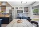 Modern kitchen featuring stainless steel appliances and stylish cabinetry with decorative shelving and plenty of counter space at 1506 Longbow Dr, Lakeland, FL 33810