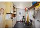 Functional utility room offering ample storage cabinets and shelving for organized convenience and efficiency at 1506 Longbow Dr, Lakeland, FL 33810