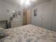 Bedroom with light blue walls, a ceiling fan, and a seashell-themed bedspread at 1610 Reynolds Rd # 80, Lakeland, FL 33801