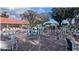 Community recreation area with lounge chairs under a gazebo, next to the clubhouse at 1610 Reynolds Rd # 80, Lakeland, FL 33801