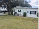 Single-story home with manicured lawn at 1610 Reynolds Rd # 80, Lakeland, FL 33801