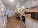 Bright kitchen featuring white cabinetry and practical layout at 1610 Reynolds Rd # 80, Lakeland, FL 33801