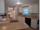 Well-lit kitchen with ample counter space and functional appliances at 1610 Reynolds Rd # 80, Lakeland, FL 33801