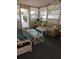 Bright sun room with neutral decor and an open doorway to the outside at 1610 Reynolds Rd # 80, Lakeland, FL 33801