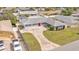 Aerial view of a single-Gathering home featuring a well-manicured lawn and spacious driveway at 170 Browning Cir, Winter Haven, FL 33884