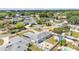 This aerial view showcases a property with a backyard fire pit, an outdoor seating area, and a fenced-in pool at 170 Browning Cir, Winter Haven, FL 33884