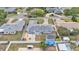 A bird's-eye view of a home with a spacious backyard, shed, and cozy fire pit at 170 Browning Cir, Winter Haven, FL 33884