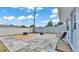 Spacious backyard with stone pavers, gravel, a fire pit, and full fence for added privacy at 170 Browning Cir, Winter Haven, FL 33884