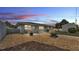 Well-kept backyard featuring a fire pit, gravel, and wood chips at 170 Browning Cir, Winter Haven, FL 33884