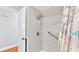 Accessible shower with grab bars and a handheld shower head for safety and convenience at 170 Browning Cir, Winter Haven, FL 33884