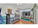 Comfortable bedroom with a desk, television, and bright storage cubes for an organized space at 170 Browning Cir, Winter Haven, FL 33884