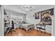 Bright bedroom with a ceiling fan, large windows, and a comfortable bed for relaxation at 170 Browning Cir, Winter Haven, FL 33884