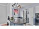 Bright kitchen featuring a breakfast bar, track lighting and stainless appliances at 170 Browning Cir, Winter Haven, FL 33884