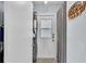 Functional laundry room with a stackable washer and dryer, and an exterior door for convenience at 170 Browning Cir, Winter Haven, FL 33884