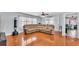 Cozy living room with hardwood floors, large windows and a comfortable sectional sofa at 170 Browning Cir, Winter Haven, FL 33884