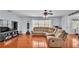 Cozy living room with hardwood floors, large windows and a comfortable sectional sofa at 170 Browning Cir, Winter Haven, FL 33884