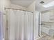 Bathroom view showing walk-in shower and white built-in storage at 1823 Sherwood Hill Dr, Lakeland, FL 33810