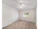 Carpeted bedroom with ceiling fan and window at 1823 Sherwood Hill Dr, Lakeland, FL 33810