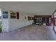 Attached carport featuring a golf cart and access to the screened-in lanai at 1823 Sherwood Hill Dr, Lakeland, FL 33810