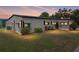Well-maintained home showcasing tidy landscaping and awning covered windows at 1823 Sherwood Hill Dr, Lakeland, FL 33810