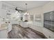 Open-concept kitchen with modern flooring, stainless steel appliances, and bright natural lighting at 1823 Sherwood Hill Dr, Lakeland, FL 33810