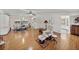 Bright living room featuring hardwood floors, ceiling fan, and an open layout at 1823 Sherwood Hill Dr, Lakeland, FL 33810