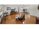 Cozy living room with hardwood floors, ceiling fan, and comfortable seating at 1823 Sherwood Hill Dr, Lakeland, FL 33810