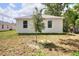 View of a home with a spacious backyard, complete with a young tree that provides a touch of nature at 1850 Martin Luther King, Jr. E Blvd, Bartow, FL 33830