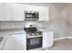 This well-equipped kitchen features stainless appliances, white cabinetry, and granite countertops at 1850 Martin Luther King, Jr. E Blvd, Bartow, FL 33830