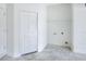 An unfinished laundry room with a bi-fold door and utility connections, ready for personalization at 1850 Martin Luther King, Jr. E Blvd, Bartow, FL 33830
