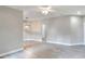 Bright living room featuring wood-look flooring, modern light fixtures, and neutral paint at 1850 Martin Luther King, Jr. E Blvd, Bartow, FL 33830